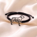 Custom pet bracelet with the dog's silhouette and name, black finish on a black braided cord